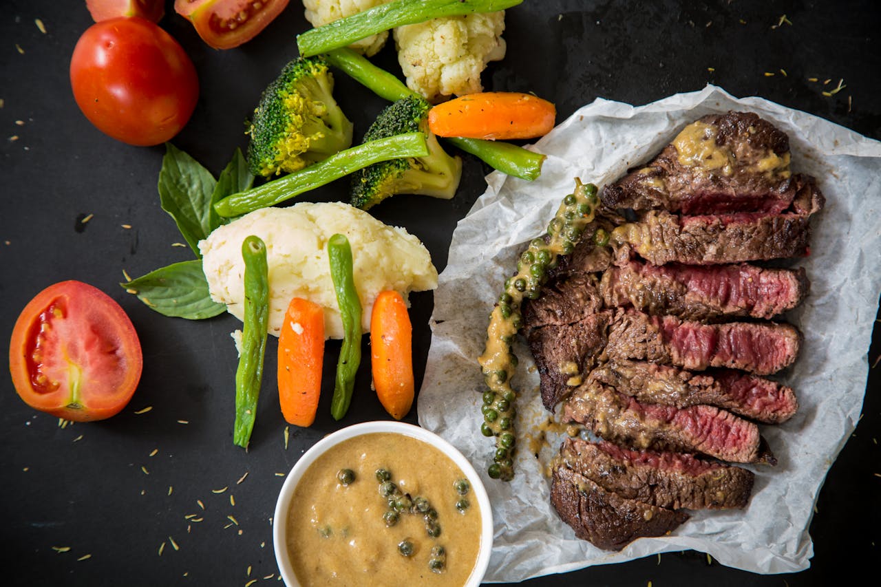 Crafting Captivating Headlines: Your awesome post title goes here Grilled steak served with fresh vegetables and pepper sauce, presenting a colorful and appetizing meal.